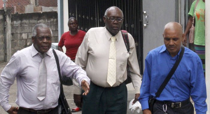 Accused Ehud Myer, centre, former co-accused Colbert Bowens, right, and other persons leave the Serious Offences Court on Monday. (iWN photo)