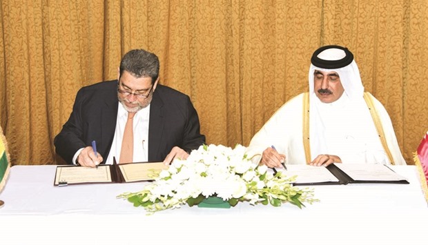HE Jassim Seif Ahmed al-Sulaiti, left, and Ralph Gonsalves signed an agreement on aerial transport co-operation in Doha yesterday. (Photo: Gulf Times)
