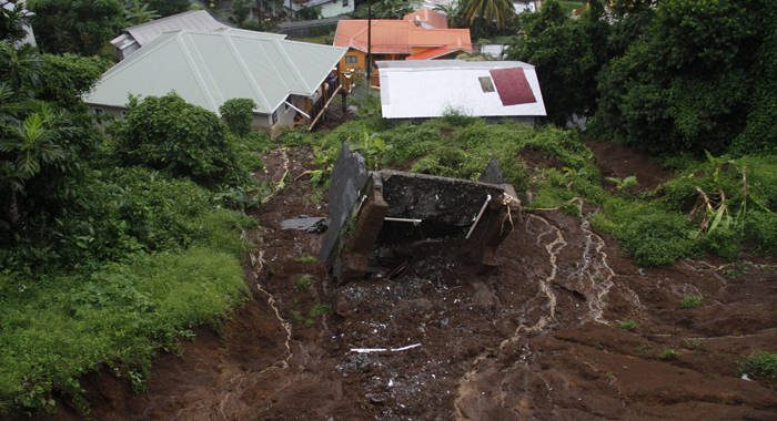 Torrential rains from trough systems in St. Vincent and the Grenadines in November 2016 resulted in landslides like this one, which swept one structure away and threatened nearby houses. Credit: Kenton X. Chance/IPS