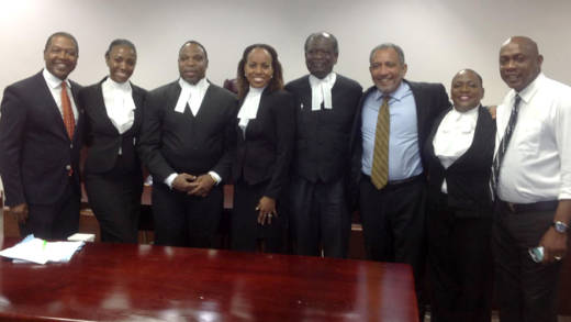 Friday, 3rd from right, and the NDP's legal team and petitioners after Tuesday's court decision. (Photo: Kay Bacchus-Baptiste/Facebook)