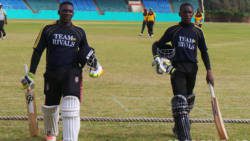 Casmond Walters 135*, left, and Dillon Douglas 43*after sharing in the 182* third wicket partnership.
