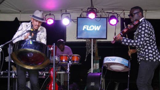 Rodney Small on pan and Darron Andrews on violin perform at Plug & Play on Saturday. (iWN photo)