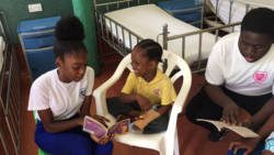 Intermediate High School Young Leaders read to patients at the CHildren's Ward of the Milton Cato Memorial Hospital. 