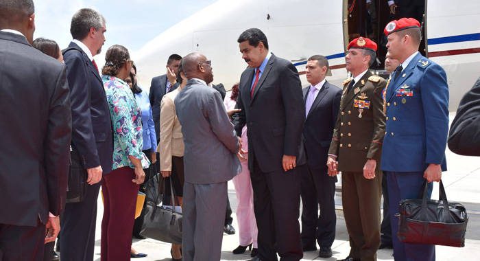 SVGs Minister of Foreign Affairs, Sir Louis Straker, left, greet President of Venezuela, Nicolas Maduro at Argyle International Airport on Wednesday. (Photo: SVG Airports) 
