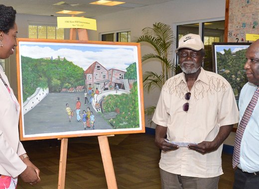 From left: Librarian at the National Archives, Jeon Adams-Julien, Owen Ralph and Education Minister Jimmy Prince, contemplate one of Ralph's paintings during Library Week.