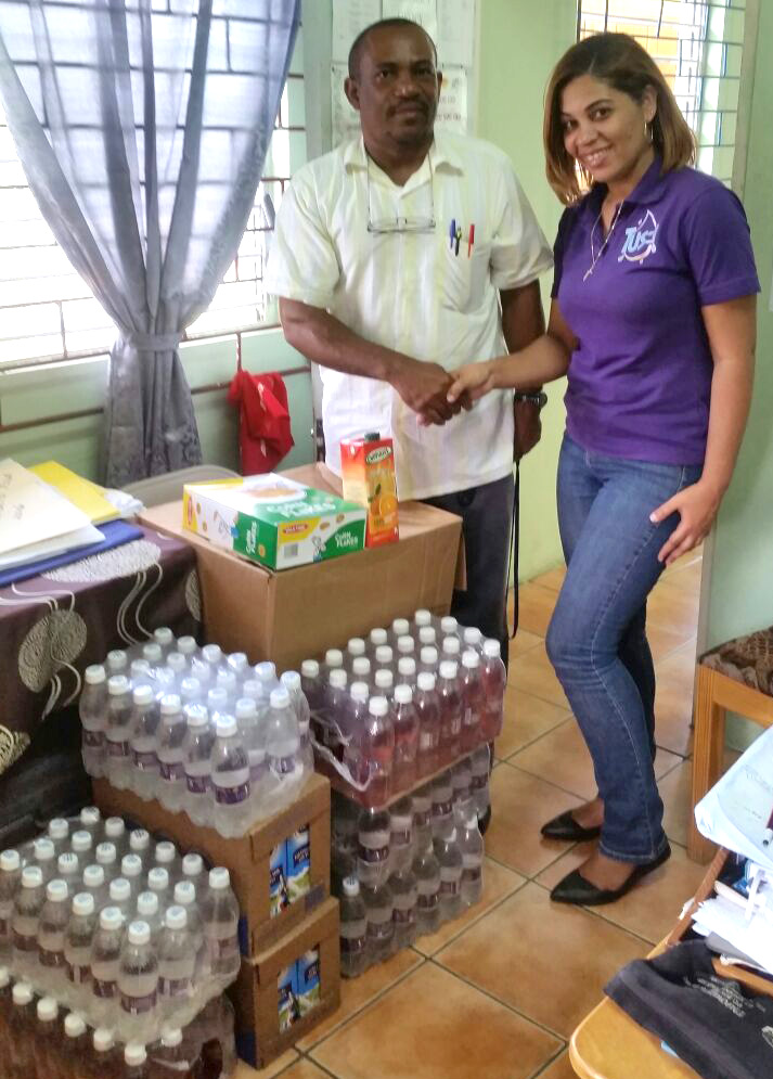 Tus T water hands over school feeding supplies