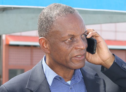Then-President of the SVG Football Federation, Venold Coombs speaks on his cellphone at a football event in Kingstown in April 2017. 
 FIFA on Tuesday banned him from all football-related activities  administrative, sports or otherwise  for two years and fined him US$40,000 (iWN photo)