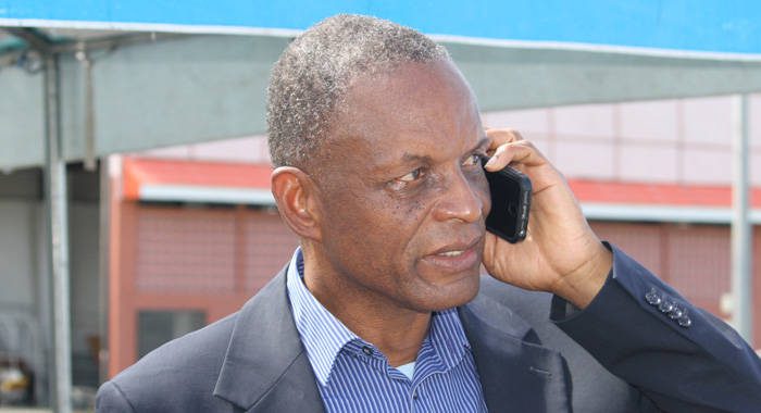 Then-President of the SVG Football Federation, Venold Coombs speaks on his cellphone at a football event in Kingstown in April 2017. 
 FIFA on Tuesday banned him from all football-related activities  administrative, sports or otherwise  for two years and fined him US$40,000 (iWN photo)
