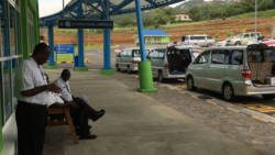 Taxi drivers wait for passengers outside AIA on Sunday. (iWN photo)