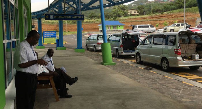 Taxi drivers wait for passengers outside AIA on Sunday. (iWN photo)