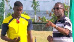 Police paceman Darius "Bread" Martin, left, is already showing the benefits of the session with West Indies legend, Michael Holding, right.