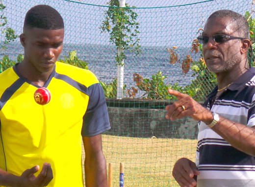 Police paceman Darius "Bread" Martin, left, is already showing the benefits of the session with West Indies legend, Michael Holding, right.