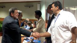 Prime Minsiter Ralph Gonsalves, left, greets delegates at the seminar on Monday. (iWN photo)