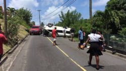 Persons make frantic phone calls and try to help the injured after the accident.