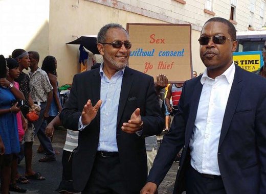 NDP leader, Dr. Godwin Friday, left, and petitioner Ben Exerter, celebrate the court ruling in Kingstown on Friday. (Photo: NDP)