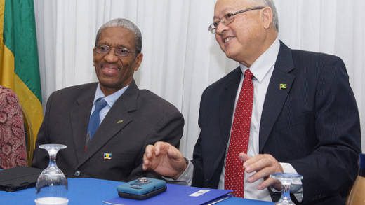 Dr. Douglas Slater, assistant secretary-general, Human and Social Development, CARICOM Secretariat, left, and Jamaicas Minister of Justice, Delroy Chuck.