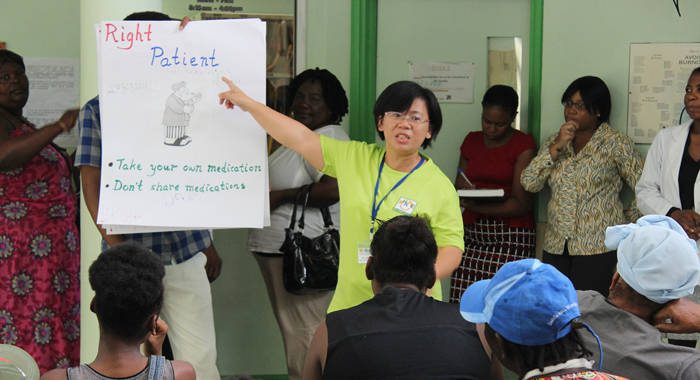 CCH Chief Pharmacist, Sock-ping Ng, introduces the 5 rights medication administration protocol to the Vincentian patients on July 17 at MCMH. 