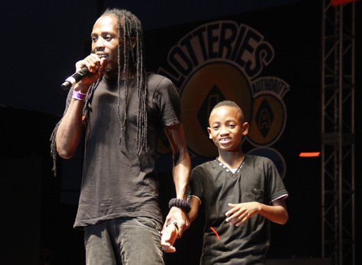 Fireman Hooper and his son, Chenzhen Hooper on stage Sunday morning. (iWN photo)