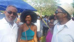 Opposition Leader, Dr. Godwin Friday, left, interact with persons at the picnic. (Photo: Facebook)