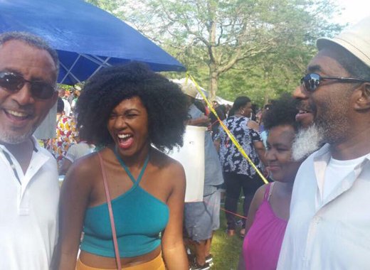 Opposition Leader, Dr. Godwin Friday, left, interact with persons at the picnic. (Photo: Facebook)