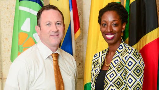 Jeon Adams-Julien, right, poses with Deputy Public Affairs Officer Jeff Barrus before departing on the U.S. Department of States International Visitor Leadership Program.