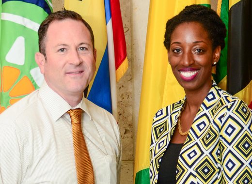 Jeon Adams-Julien, right, poses with Deputy Public Affairs Officer Jeff Barrus before departing on the U.S. Department of States International Visitor Leadership Program.