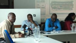 AIA security chief, Keith Miller, left, speaks to the media (not seen) on Monday as other AIA officials look on. (iWN photo)