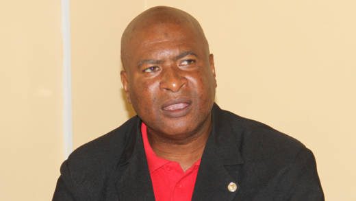 Oswald Robinson, president of the SVG Teachers' Union speaks at Tuesday's press conference. (iWN photo)