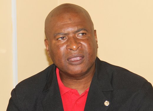 Oswald Robinson, president of the SVG Teachers' Union speaks at Tuesday's press conference. (iWN photo)