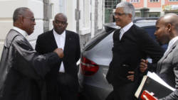 Lawyers for the petitioners and respondents chat outside the High Court on Wednesday. (iWN photo)