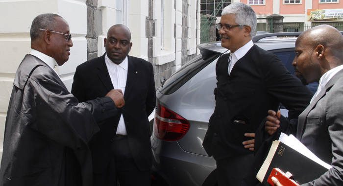 Lawyers for the petitioners and respondents chat outside the High Court on Wednesday. (iWN photo)