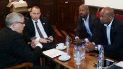 Minister of Agriculture, Saboto Caeser, Sen. and Deputy Speaker of the House of Assembly, . Carlos James meet with Chairman of ALBA Bank Ramon Gordils.