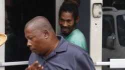 The virtual complainant, Andrew Soleyn, forefront, and his brother, Jason Soleyn, the accused, leave court after the proceedings on Monday. (iWN photo)