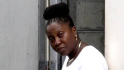 Afranka Hackshaw-Graham  stands outside the Serious Offences Court on Wednesday after being granted bail. (iWN Photo)