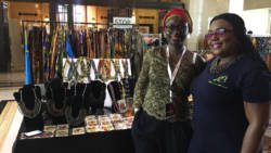 Vincentian designer Ingrid John, right, poses with a Nigerian designer. (Photo: Diandra Shortte)