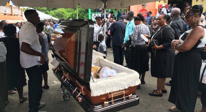 Persons pay their last respect during the community viewing of Oscar Alllen's body in Diamonds last Saturday. (iWN photo)