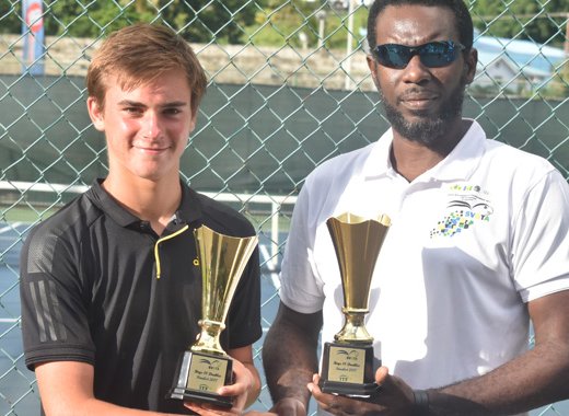 Singles champ and doubles runner up Eliot Spizzirri collects trophy from Brian Nash, president SVGTA.