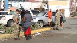 British troops speak to persons in Road Town on Monday. (CMC photo)