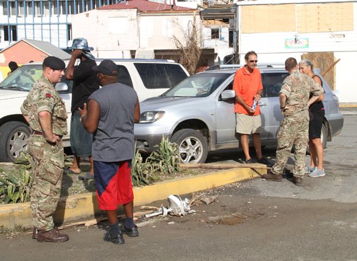 British troops speak to persons in Road Town on Monday. (CMC photo)