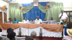 Burnett speaks at the meeting on Sunday.
