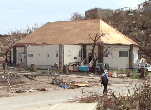 Some 10 Vincentians, including two children, are among Caribbean nationals living in this damaged building after their homes were destroyed. (iWN photo)