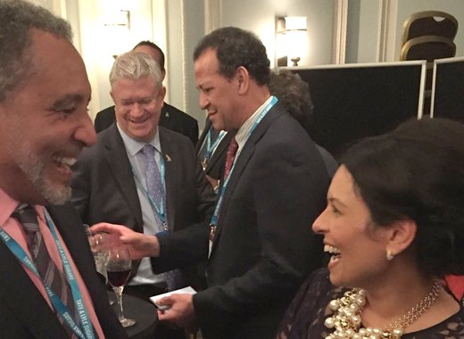 Opposition Leader, Dr. Godwin Friday, left, and Priti Patel, UK Secretary of State for International Development share a light moment at International delegates reception.