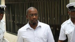 Former journalist, Junior Jarvis leaves the Serious Offences Court on Thursday after being committed to stand trial for murder. (iWN photo)