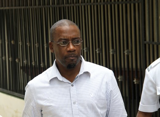 Former journalist, Junior Jarvis leaves the Serious Offences Court on Thursday after being committed to stand trial for murder. (iWN photo)