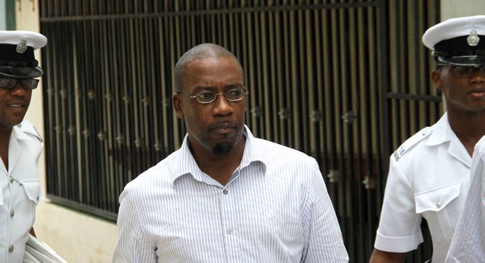 Former journalist, Junior Jarvis leaves the Serious Offences Court on Thursday after being committed to stand trial for murder. (iWN photo)