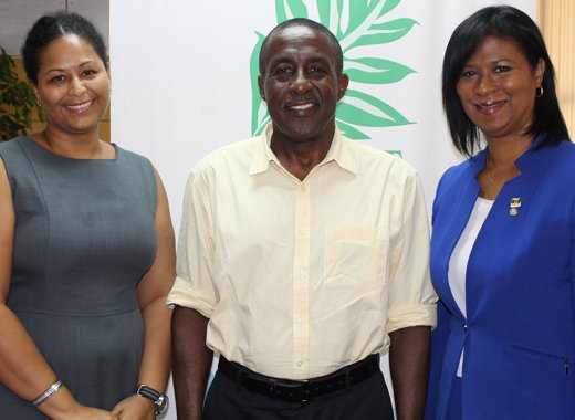 Chair of Invest SVG, Anthony Regisford, center, welcomes Executive Director, Annette Mark, right, and Deputy Executive Director, Nadine Agard-Juillerat (left) to Invest SVG.