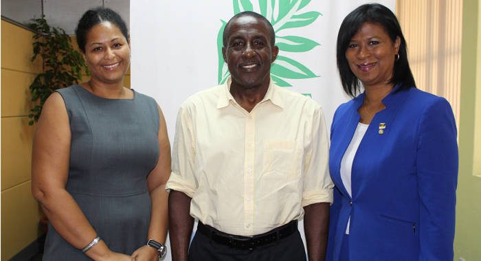Chair of Invest SVG, Anthony Regisford, center, welcomes Executive Director, Annette Mark, right, and Deputy Executive Director, Nadine Agard-Juillerat (left) to Invest SVG.