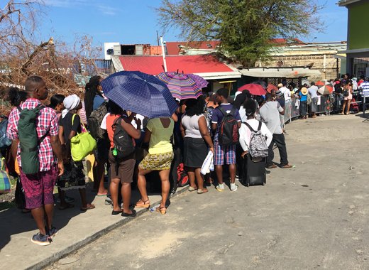 Persons queue outside the deep water harbour on Roseau on Thursday hoping for an opportunity to leave storm ravaged Dominica. CMC photo