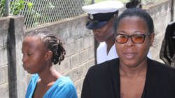 Shaffique Martin, left, and Diana-Quammie leave the Serious Offences court under police escort. (iWN photo)