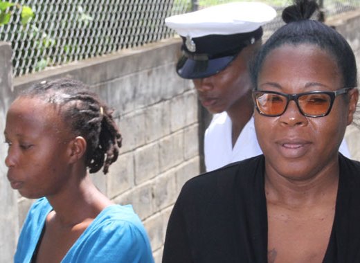 Shaffique Martin, left, and Diana-Quammie leave the Serious Offences court under police escort. (iWN photo)